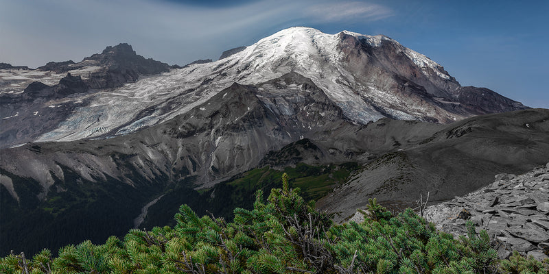 A snow capped peak overlooking alpine wilderness